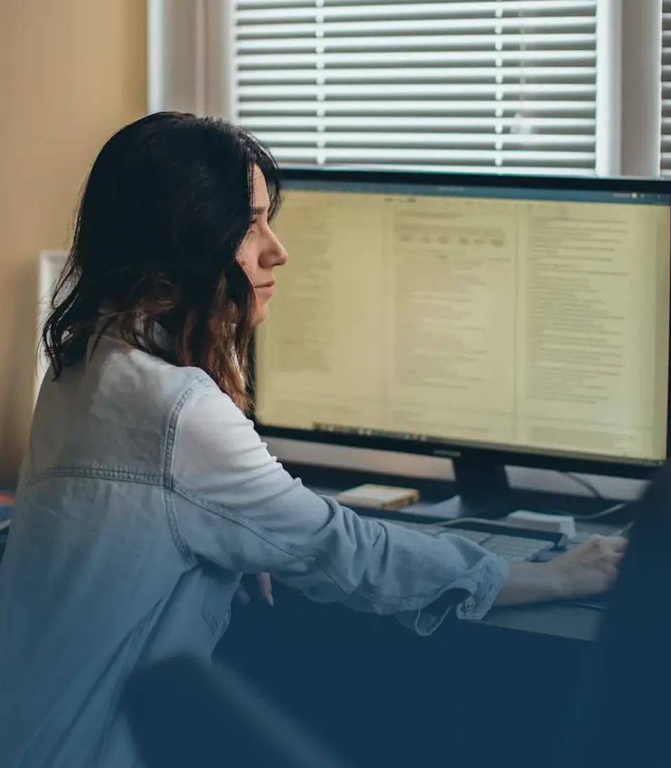 Female employee at work station.