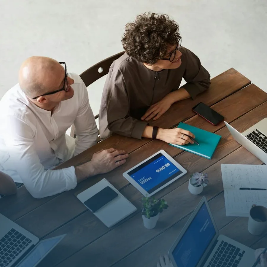 Two employees during a meeting or audit actively participating.