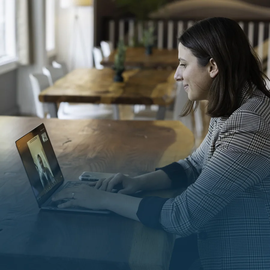 Female employee participating in an online call with another male employee.