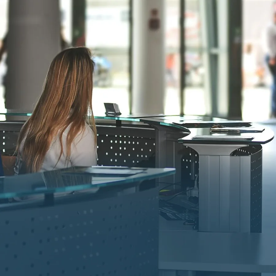 Company secretary at reception desk.