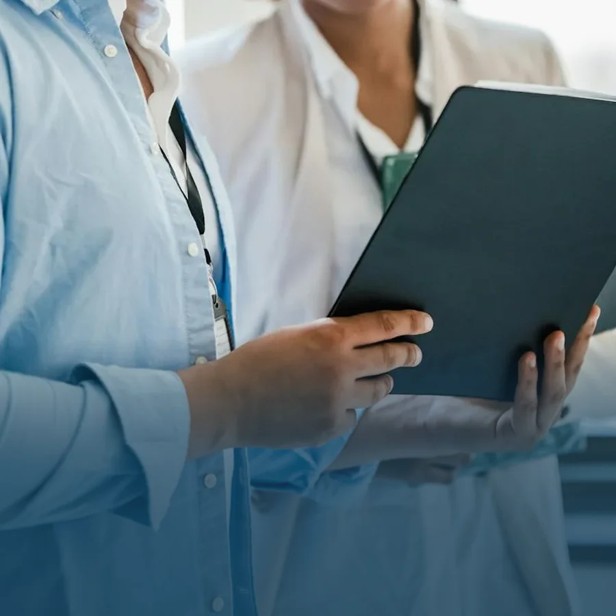 Two employees discussing a financial statement or personal tax.